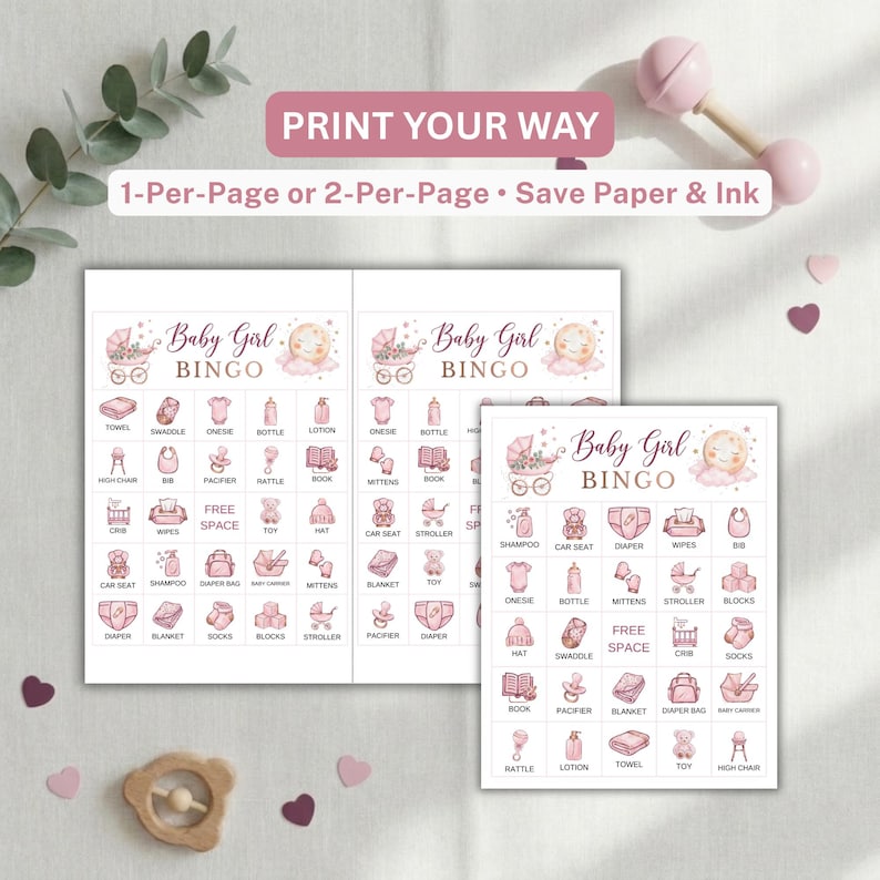 May include: A printable baby girl bingo game set featuring pink illustrations of baby items like a stroller, onesie, and bottle. The cards include the text Baby Girl BINGO and a free space. The layout shows options for 1-per-page or 2-per-page printing.