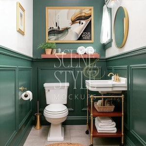 May include: A bathroom interior with dark green paneling, a white toilet, and a vintage sink. A framed artwork with abstract art hangs above a shelf with towels and plants. The text "YOUR IMAGE HERE" is visible on the artwork.