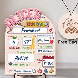 May include: A wooden arch-shaped sign for the first day of preschool, personalized with the name Alice in pink letters. It features sections for age 4, height 42 inches, favorite colors, teacher Mrs. Thompson, and future goals. Includes a round bag tag.