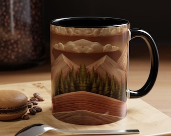 May include: A ceramic coffee mug with a black interior and handle. The mug features a landscape design with mountains, trees, and clouds in shades of brown and green. A spoon and a pastry are on a wooden surface.