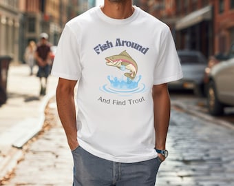 May include: White t-shirt with a graphic of a jumping trout and the text "Fish Around And Find Trout" in blue. The shirt is short-sleeved and worn with blue jeans.
