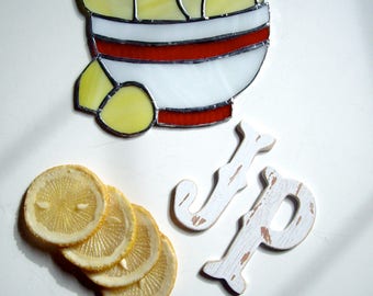 When the world gives you lemons make a lemon suncatcher. Large stained glass bowl of Lemons