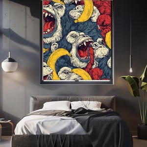 May include: A framed wall art print featuring a vibrant, detailed illustration of screaming gorillas, bananas, and red accents. The artwork is displayed above a bed with white bedding and a dark gray blanket. The room has a modern, minimalist design.