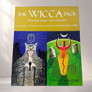 May include: The Wicca Pack, a book and divinatory card set. The cover features illustrations of an owl-headed figure and a stylized female form. The text reads "Weaving magic into your life" and "Contains the Wicca book and set of divinatory cards."
