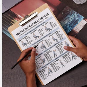 May include: A clipboard featuring a printed guide for senior knee care exercises. The guide provides illustrations and instructions for exercises such as seated marching, heel slides, and calf stretches. A hand holds a pen, indicating the exercises.