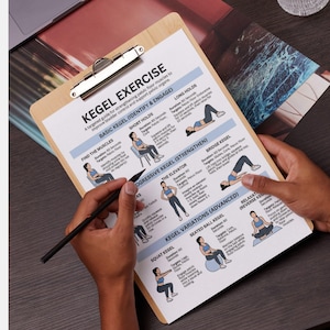 May include: A wooden clipboard with a printed guide titled "KEGEL EXERCISE" is held by a person. The guide illustrates various exercises to strengthen pelvic floor muscles. A black pen points to the guide, highlighting the instructions.
