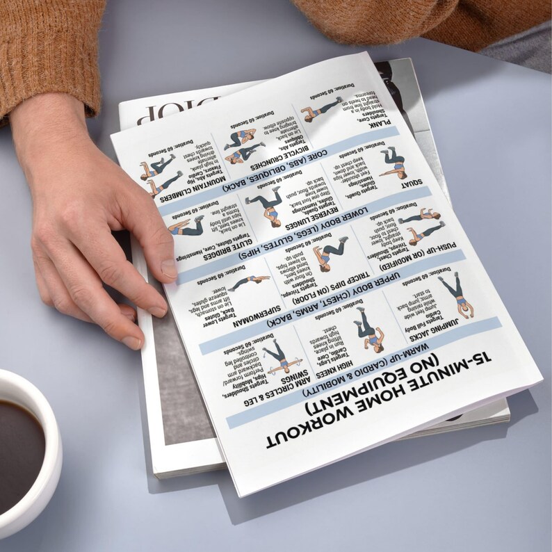 May include: A printed workout guide titled "15-Minute Home Workout (No Equipment)" with exercise diagrams. The guide includes warm-up exercises, and sections for upper and lower body workouts. The guide is on top of a magazine.