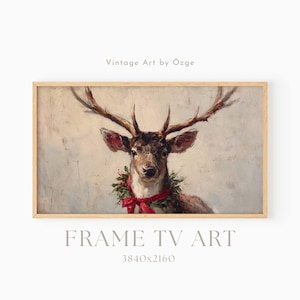 May include: A framed vintage painting of a deer with large antlers, wearing a festive wreath and red ribbon. The artwork is labeled "Vintage Art by Özge" and "FRAME TV ART 3840x2160". The painting has a neutral background.