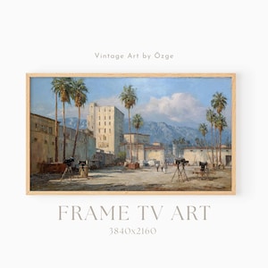 Könnte beinhalten: Ein gerahmter Vintage-Kunstdruck, der eine sonnige Szene im Freien mit Palmen, Gebäuden und Bergen im Hintergrund zeigt. Das Kunstwerk trägt die Bezeichnung "Vintage Art by Özge" und "FRAME TV ART". Die Auflösung beträgt 3840x2160.