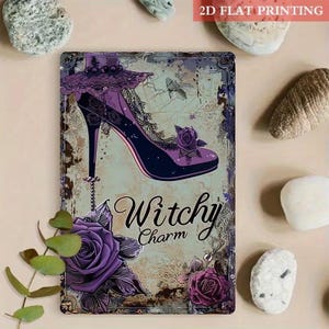 May include: A rectangular metal sign featuring a high-heeled shoe with lace and rose details in shades of purple and black. The text Witchy Charm is printed in a black script font. The background has a distressed, vintage-style light texture.