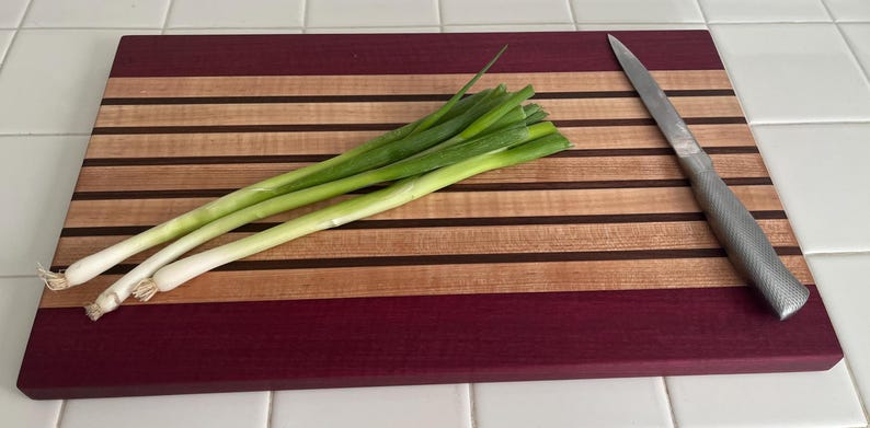 Walnut and maple signature stripe cutting board