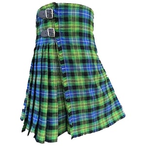 May include: A green, blue, and black plaid kilt with two leather straps and silver buckles. The kilt is pleated and wraps around the waist. The fabric has a traditional tartan pattern.