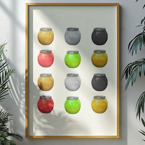 Puede incluir: Una impresión enmarcada que presenta doce ilustraciones de tarros coloridos en una cuadrícula. Los tarros son de varios colores, incluyendo amarillo, rojo, verde, gris y negro, cada uno con una tapa plateada. La obra de arte se muestra contra una pared blanca, con plantas verdes en primer plano.
