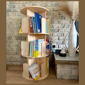 May include: A set of three ceramic mugs with a speckled, matte finish. The mugs are in shades of cream, light gray, and dark gray. Each mug has a simple, minimalist design, perfect for coffee or tea.