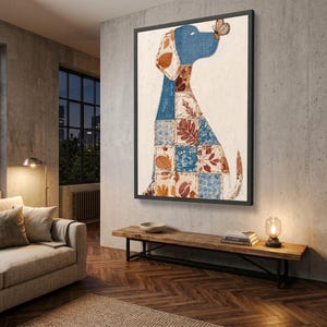 May include: A framed wall art piece featuring a stylised dog silhouette composed of a patchwork grid pattern. The dog is blue with brown leaf and floral motifs, and a small butterfly rests on its nose against a textured off-white background.