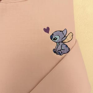 Stitch Embroidered Sweatshirt - Cute Disney Crewneck - Trip And Vacation Shirt - Trendy Tee stitch sweatshirt stitch crewneck stitch embroidered lilo and stitch stich angel disney embroidered stitch sweater embroidered disney stitch valentines stitch pullover valentine day cute adorable embroidered shirt