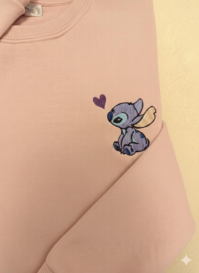 Stitch Embroidered Sweatshirt - Cute Disney Crewneck - Trip And Vacation Shirt - Trendy Tee stitch sweatshirt stitch crewneck stitch embroidered lilo and stitch stich angel disney embroidered stitch sweater embroidered disney stitch valentines stitch pullover valentine day cute adorable embroidered shirt