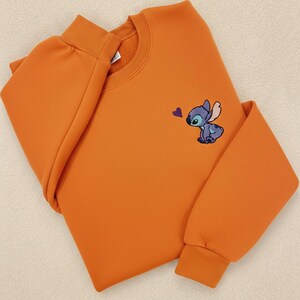Stitch Embroidered Sweatshirt - Cute Disney Crewneck - Trip And Vacation Shirt - Trendy Tee stitch sweatshirt stitch crewneck stitch embroidered lilo and stitch stich angel disney embroidered stitch sweater embroidered disney stitch valentines stitch pullover valentine day cute adorable embroidered shirt