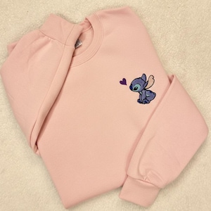 Stitch Embroidered Sweatshirt - Cute Disney Crewneck - Trip And Vacation Shirt - Trendy Tee stitch sweatshirt stitch crewneck stitch embroidered lilo and stitch stich angel disney embroidered stitch sweater embroidered disney stitch valentines stitch pullover valentine day cute adorable embroidered shirt