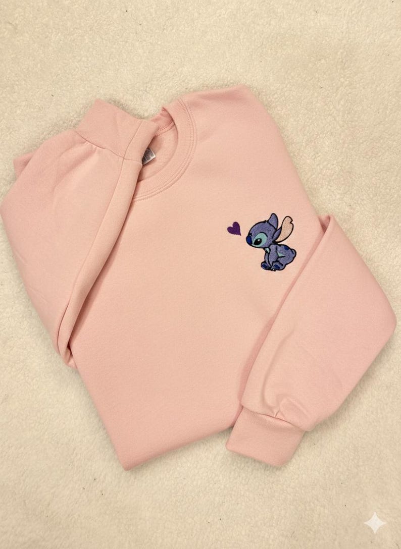 Stitch Embroidered Sweatshirt - Cute Disney Crewneck - Trip And Vacation Shirt - Trendy Tee stitch sweatshirt stitch crewneck stitch embroidered lilo and stitch stich angel disney embroidered stitch sweater embroidered disney stitch valentines stitch pullover valentine day cute adorable embroidered shirt