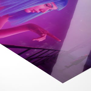 May include: A digitally enhanced image featuring a person with blue hair and a pink complexion, pointing towards a reflective surface. The color palette is dominated by shades of purple and pink, creating a futuristic aesthetic.