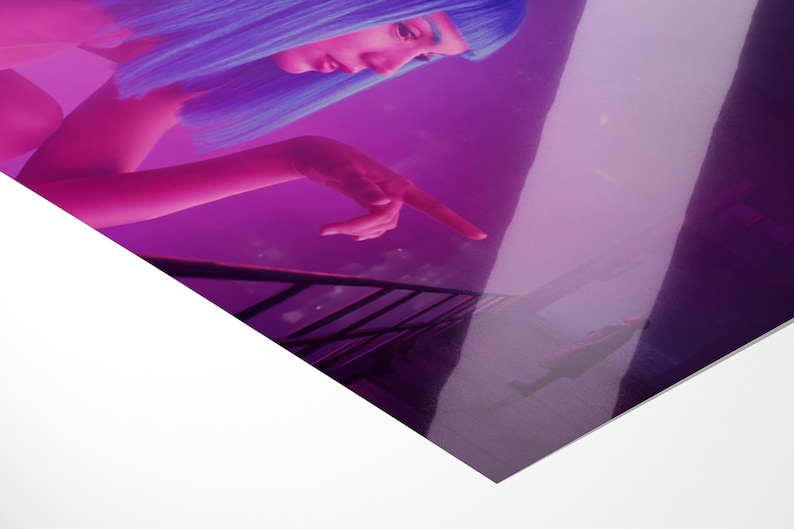May include: A digitally enhanced image featuring a person with blue hair and a pink complexion, pointing towards a reflective surface. The color palette is dominated by shades of purple and pink, creating a futuristic aesthetic.