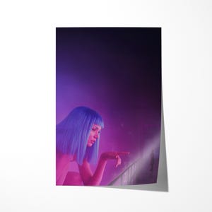 May include: A poster featuring a woman with blue hair, illuminated by pink and purple lighting. She is pointing towards a bright area, creating a futuristic and cinematic aesthetic. The background is a gradient of dark purple.