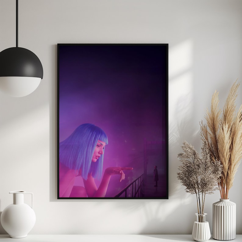 May include: A framed art print featuring a woman with blue hair, set against a purple and pink background. The woman is leaning on a railing, with a figure in the distance. The artwork has a cinematic, futuristic theme.