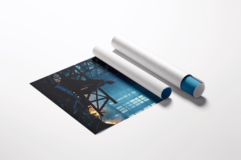 May include: A print of an industrial scene with a blue and orange color palette, next to two white poster tubes. One tube has a blue end cap. The print shows a dark silhouette of a structure against a bright background.