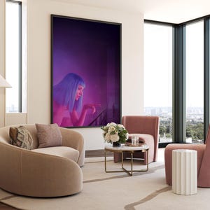 May include: A modern living room with a large framed artwork featuring a woman with blue hair. The room includes two curved beige sofas, two pink armchairs, a marble-topped coffee table, and a white side table. A large window offers a city view.