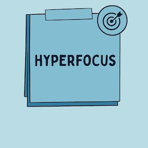 May include: A light blue notepad with the word "HYPERFOCUS" in bold, dark blue letters. A target icon is in the upper right corner. The notepad has a torn top edge. The background is a solid light blue.