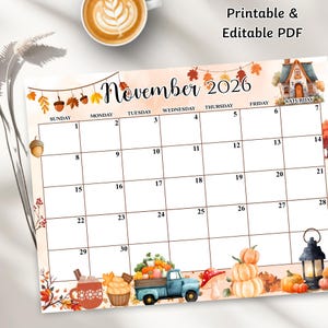 May include: A printable and editable PDF calendar for November 2026. The calendar features a watercolour design with autumn leaves, pumpkins, and a blue truck carrying pumpkins. The text "November 2026" is displayed prominently.
