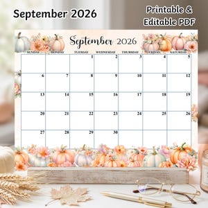 May include: A printable and editable PDF calendar for September 2026. The design features a grid layout with watercolour illustrations of pumpkins and flowers along the top and bottom borders. The text reads September 2026.