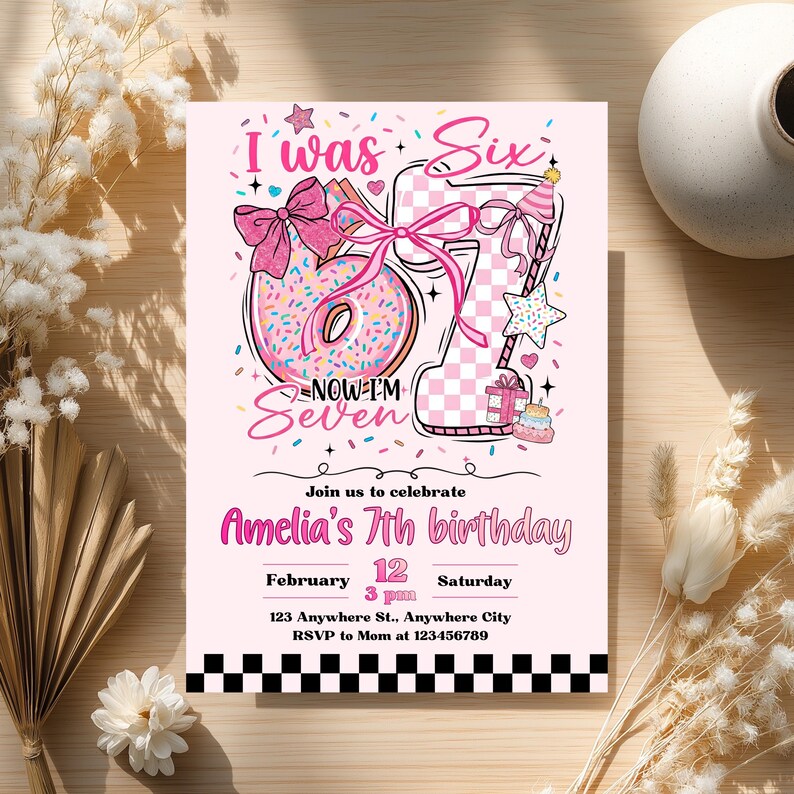 May include: A pink birthday invitation with the text "I was Six, Now I'm Seven." The design includes a donut, a checkered number seven, and a star. The invitation is for Amelia's 7th birthday, with the date, time, and location details.