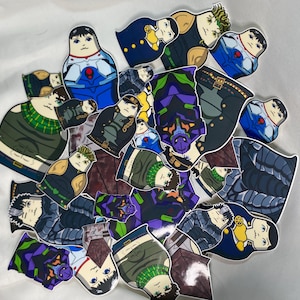 May include: A selection of colourful stickers depicting anime-style characters in various outfits. The stickers are shaped like nesting dolls, set against a white backdrop.