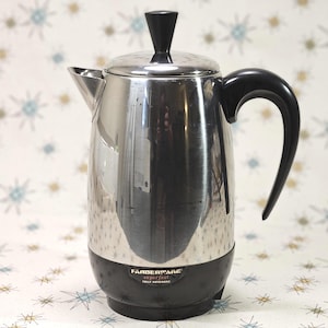 May include: A stainless steel Farberware Superfast fully automatic coffee percolator. The coffee maker has a black base, handle, and lid knob. The percolator is on a patterned background.