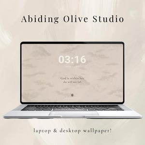 May include: A silver laptop displaying a beige wallpaper with a cloudy sky design and the time 03:16. The text "God is within her she will not fall" is also visible. The words "Abiding Olive Studio" and "laptop & desktop wallpaper!" are at the top and bottom.