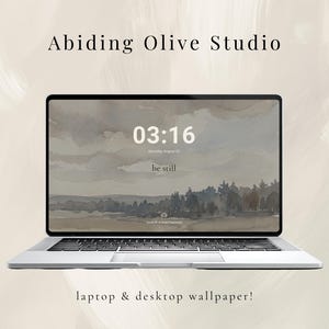 May include: A silver laptop displaying a landscape wallpaper with a time display of 03:16. The wallpaper features a watercolor painting of a rural scene with trees and a cloudy sky. The text "Abiding Olive Studio" and "laptop & desktop wallpaper!" are also visible.
