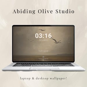 May include: A silver laptop showing a desktop wallpaper with a tranquil landscape, birds, and the time "03:16" and the phrase "God is good." The screen also displays "Touch to enter password." The words "Abiding Olive Studio" and "laptop & desktop wallpaper!" are also visible.