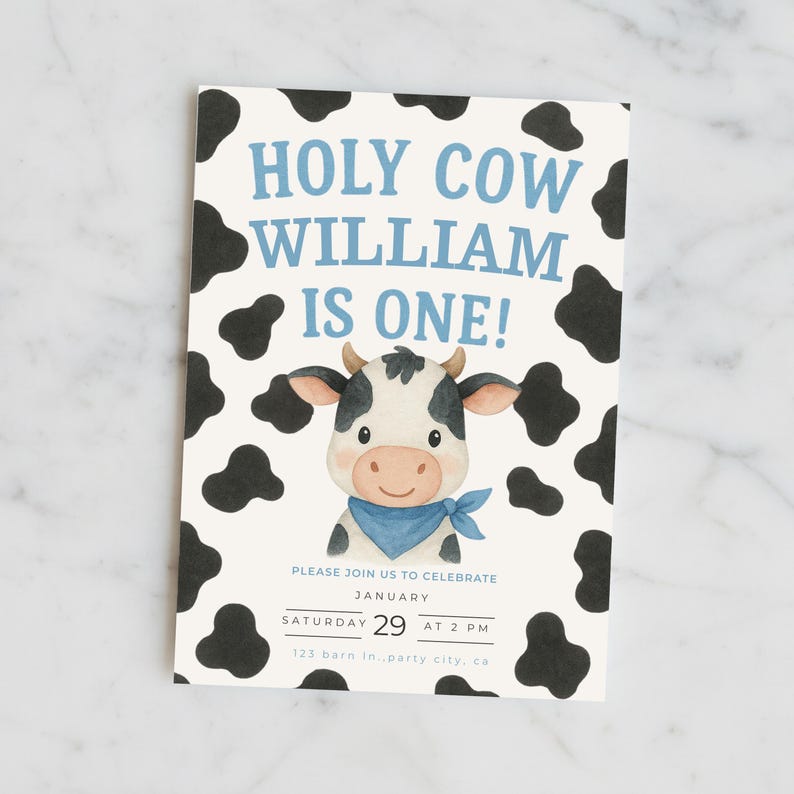 May include: A rectangular invitation card with a light blue background and black cow spots. The text "HOLY COW WILLIAM IS ONE!" is in blue. A cartoon cow with a blue bandana is in the center. The card also includes party details.