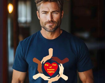 May include: Navy blue t-shirt with a graphic design. The design features a red heart surrounded by hands of various skin tones, with the words "Big Fan of human rights" inside the heart. The shirt is short-sleeved.