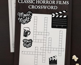 Może przedstawiać: Drukowana krzyżówka zatytułowana "CLASSIC HORROR FILMS CROSSWORD" z arkuszami "CLUES" i "ANSWER KEY". Układanka zawiera grafikę o tematyce filmowej i słowa "Movie Night". Widoczny jest również popcorn i klaps filmowy.