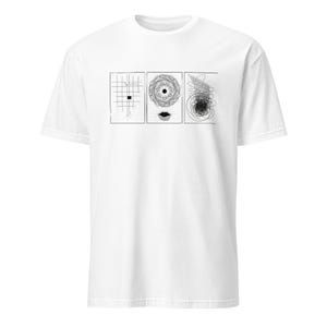 May include: White t-shirt featuring three black and white abstract drawings. The first drawing is a grid with a black square, the second is a spiral, and the third is a scribble. The shirt is made of a soft material.