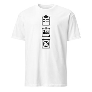 May include: White t-shirt with a black graphic design. The design features three stacked icons: a checklist, an ID badge, and a calendar. The icons are centered on the front of the shirt.