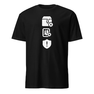 May include: Black t-shirt with a white graphic design. The design includes a broken box with an X, a person with an X, and an exclamation point inside a shield. The shirt is made of a soft material.