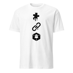 May include: White t-shirt with a black graphic design. The design features a puzzle piece, a chain link, and a ghost inside a hexagon. The symbols are aligned vertically.