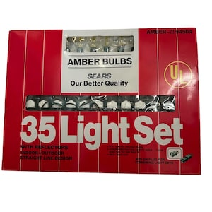 May include: A red and white box of amber light bulbs. The box reads "AMBER BULBS" and "35 Light Set". The box also has the text "SEARS Our Better Quality" and "INDOOR OUTDOOR STRAIGHT LINE DESIGN".
