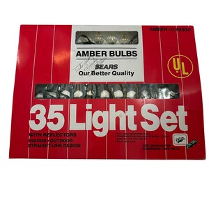 May include: A red box of amber light bulbs from Sears. The box reads "35 Light Set" and "Indoor Outdoor Straight Line Design." The box also has the UL logo and the text "Our Better Quality."
