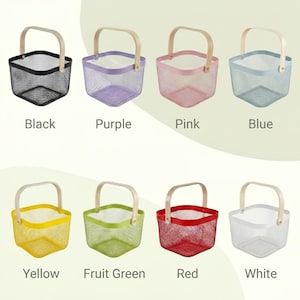 May include: A collection of eight square wire mesh baskets with light-colored wooden handles, displayed in two rows. The baskets are available in black, purple, pink, blue, yellow, fruit green, red, and white, each labeled with its color name.