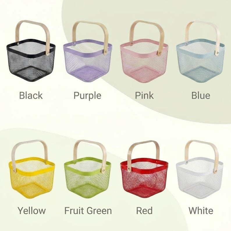 May include: A collection of eight square wire mesh baskets with light-colored wooden handles, displayed in two rows. The baskets are available in black, purple, pink, blue, yellow, fruit green, red, and white, each labeled with its color name.
